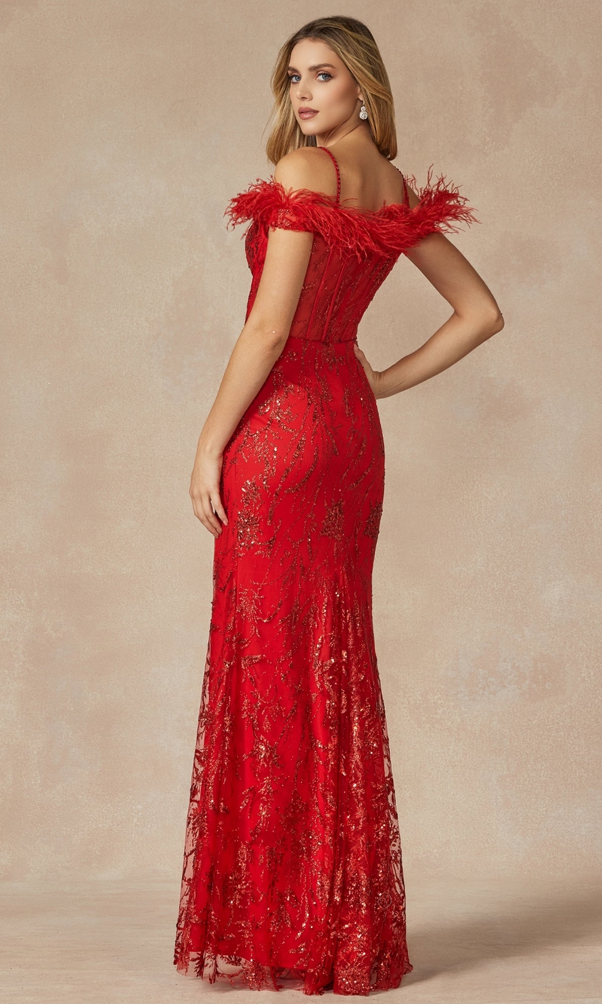 A woman models the Feather Cold-Shoulder Long Glitter Prom Dress 2402, a floor-length red gown with feathered off-the-shoulder trim, corset bodice, and sparkling sequin details, posed against a neutral background.